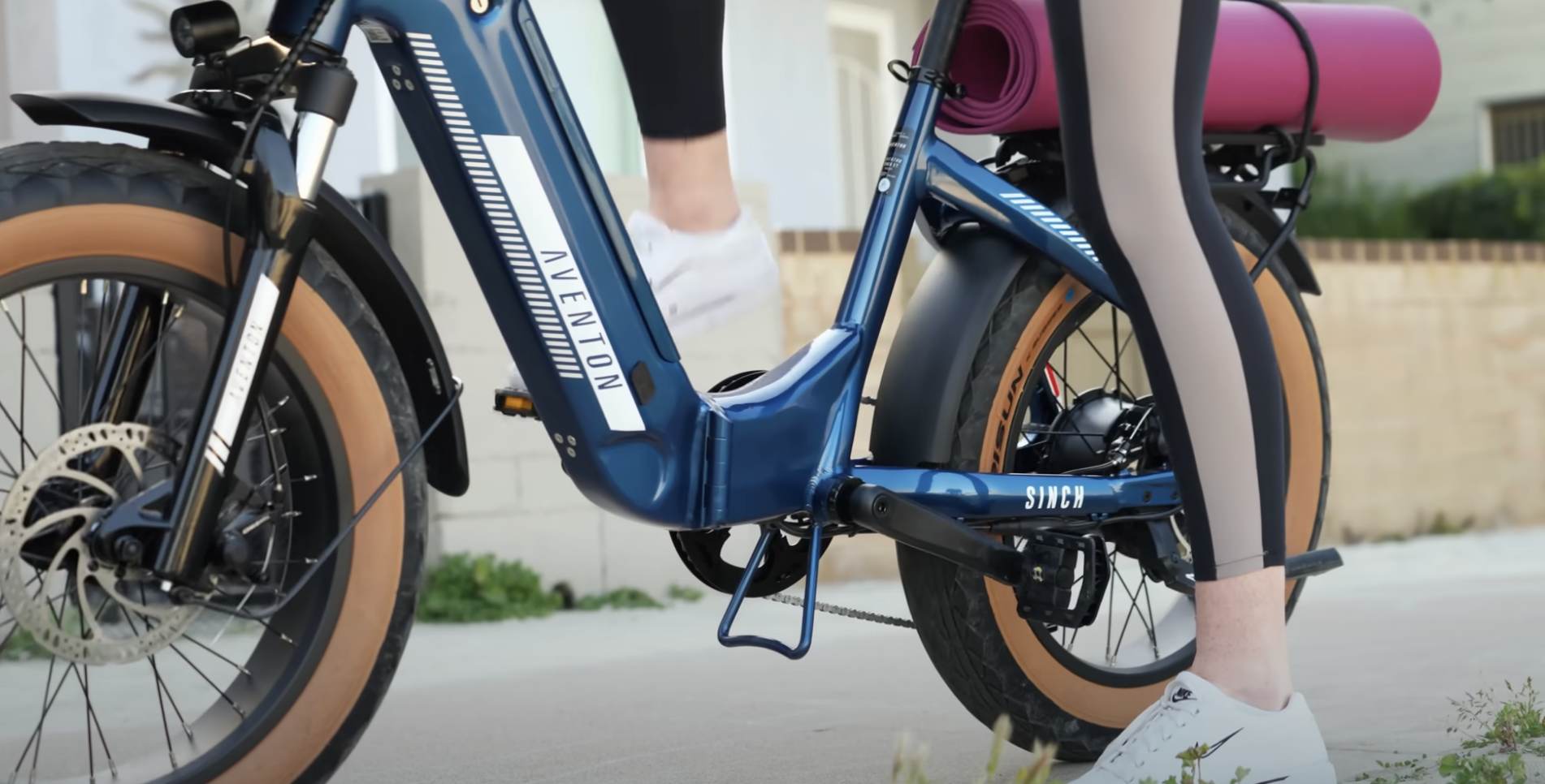 girl riding blue bicycle av...