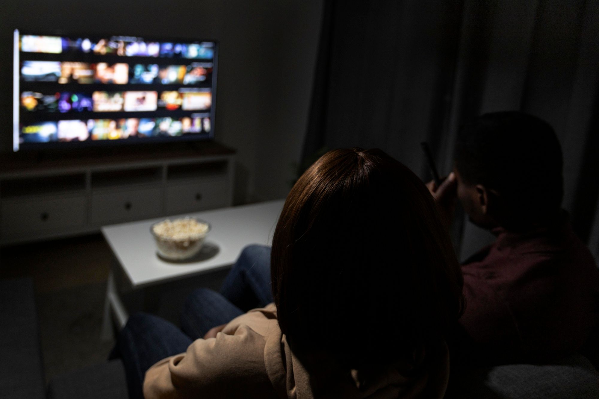 woman sitting watching tv-p...