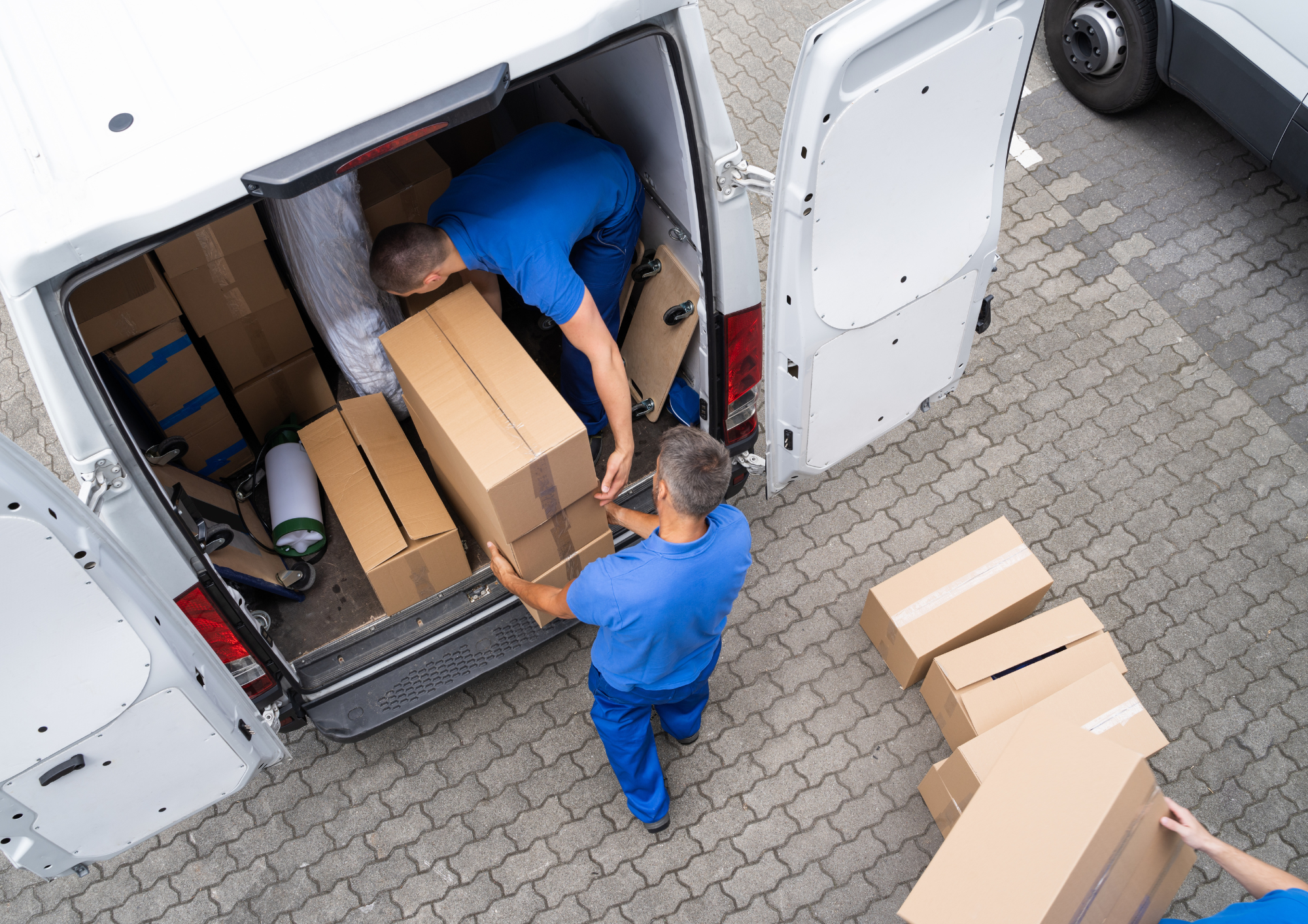 men unloading boxes from de...