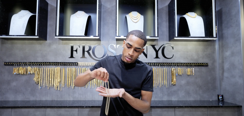 man holding gold chain-garments-jewelry-jewelry-frost nyc store