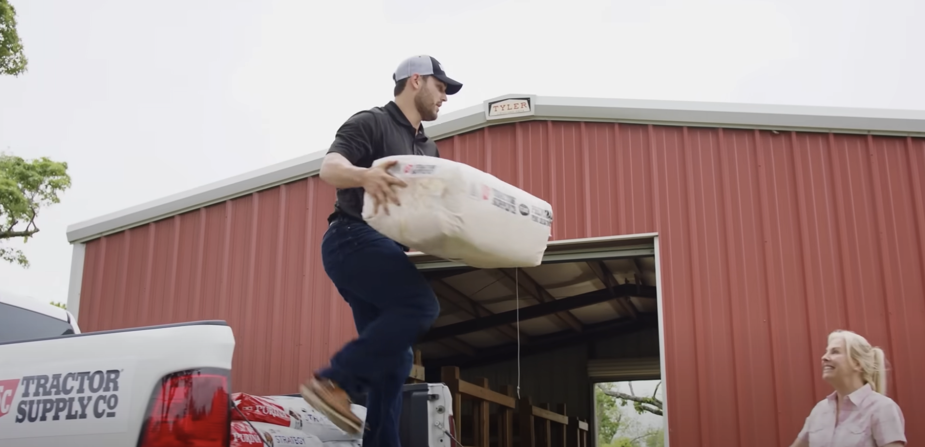 man loading sack of food-tr...