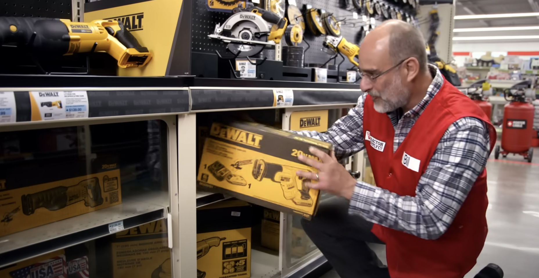 man holding tool-tractor su...