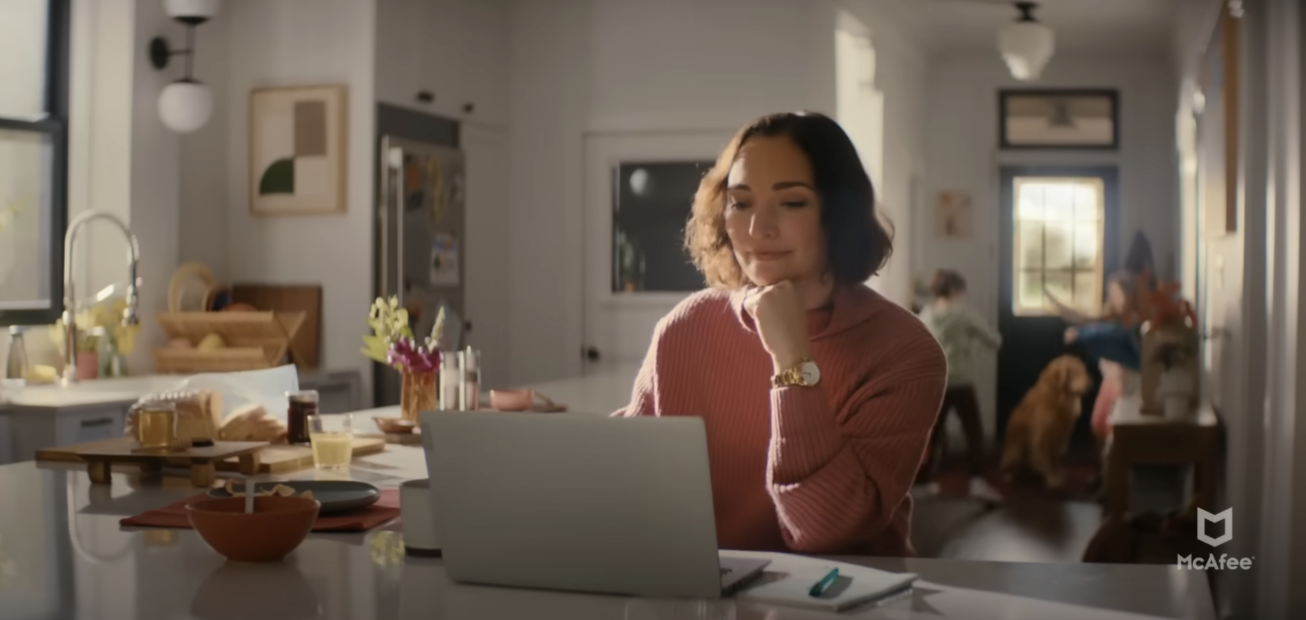 woman sitting in kitchen us...