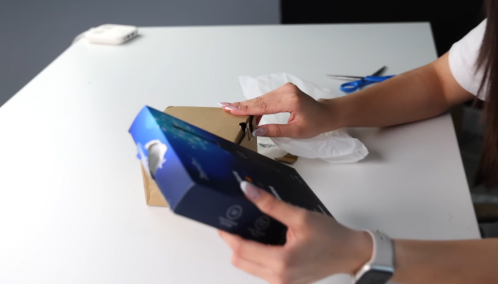 woman looking at a box of product