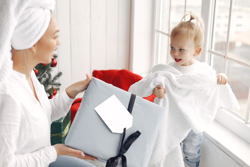 woman giving a gift to her daughter