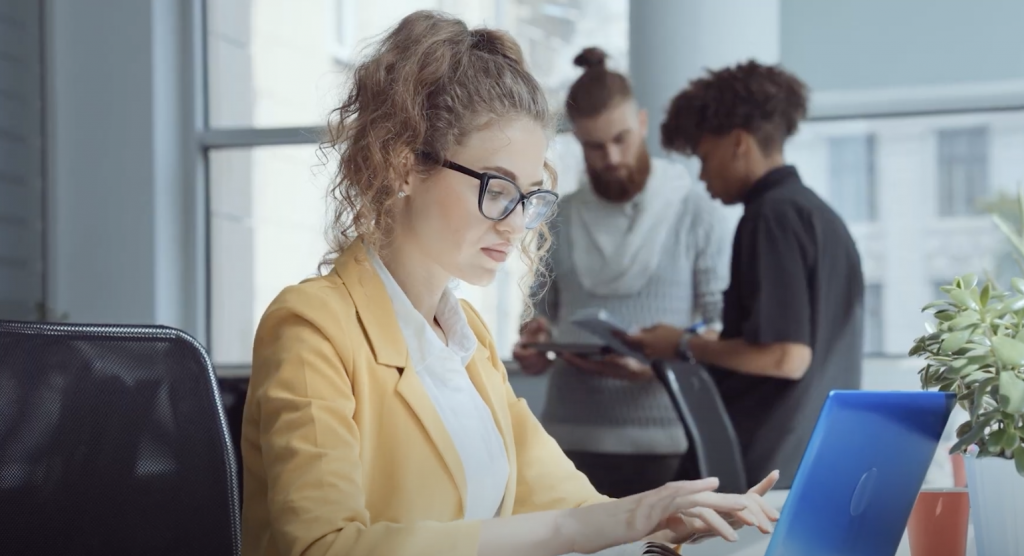 woman in office using laptop