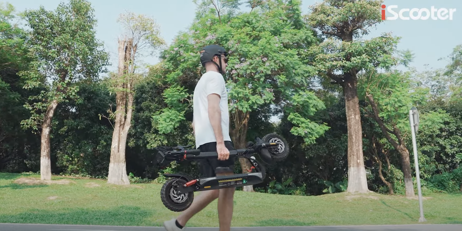 man with helmet holding iSc...